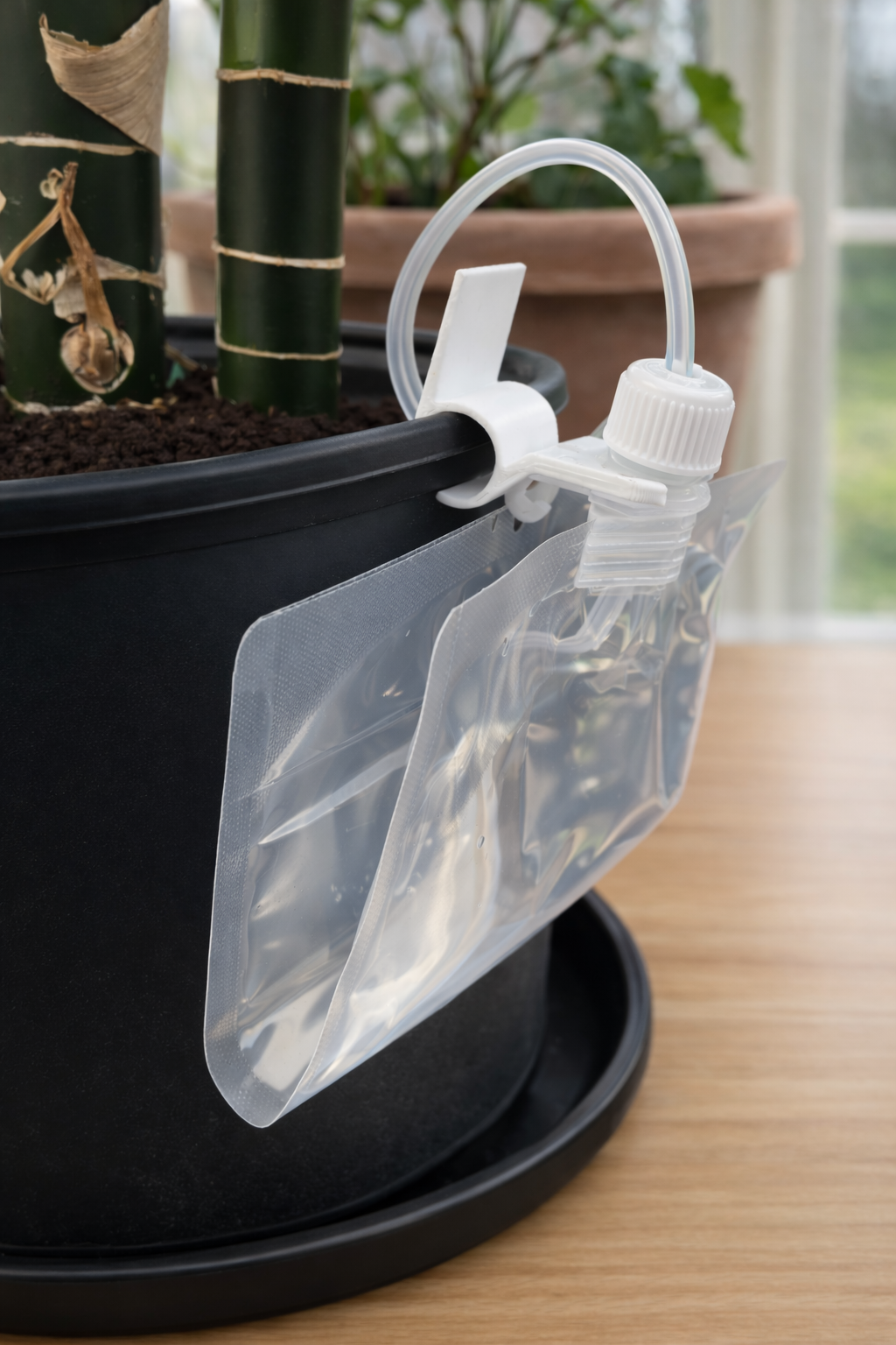 Folded LolliDrop water bag on a smaller pot